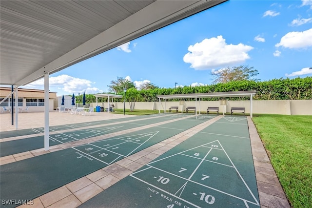 view of property's community with a lawn