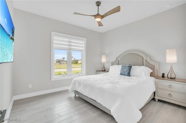 bedroom featuring light wood-type flooring and ceiling fan