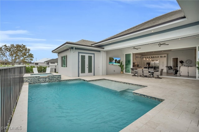 view of pool with french doors, an in ground hot tub, a patio area, and ceiling fan