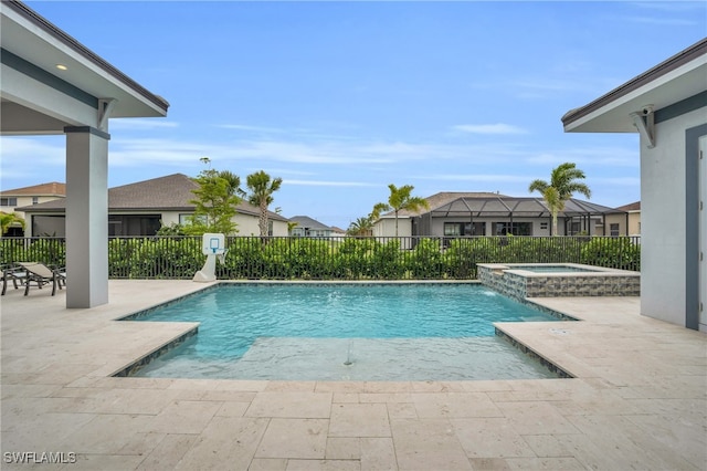 view of pool featuring an in ground hot tub, pool water feature, and a patio