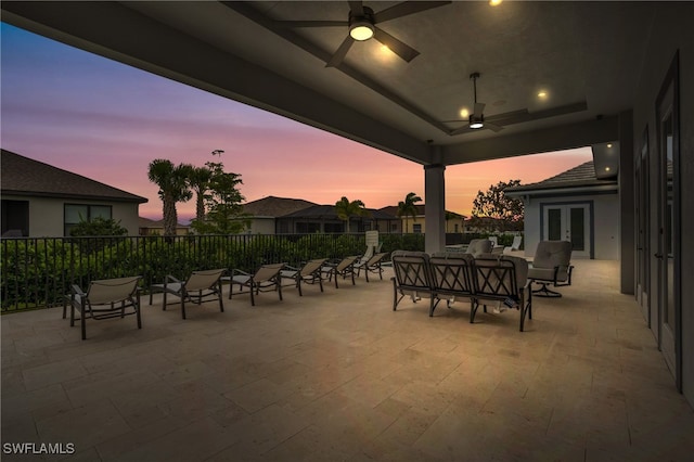 patio terrace at dusk featuring ceiling fan