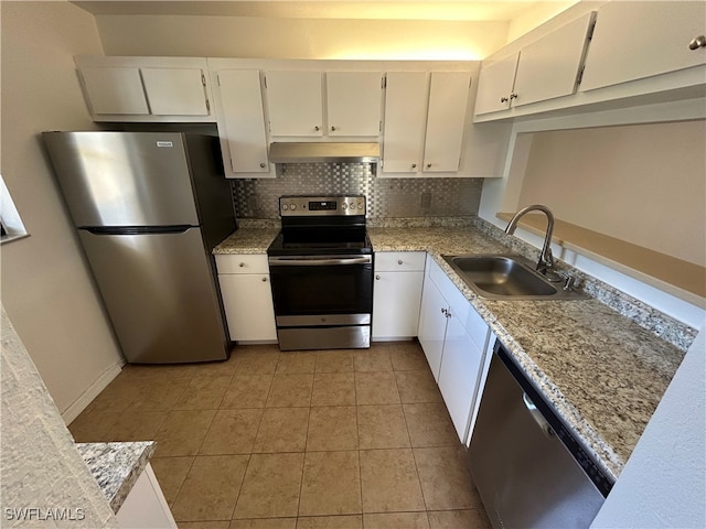 kitchen featuring appliances with stainless steel finishes, white cabinetry, sink, and exhaust hood