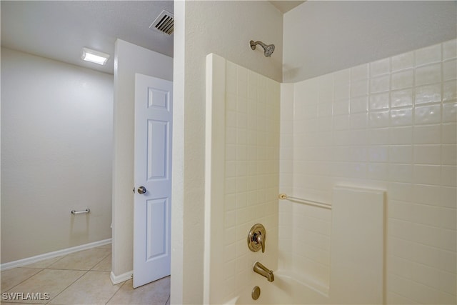 bathroom with bathing tub / shower combination and tile patterned flooring