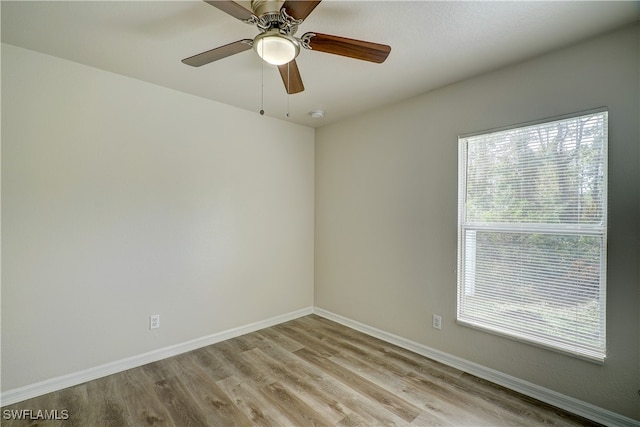 spare room featuring ceiling fan and light wood-type flooring