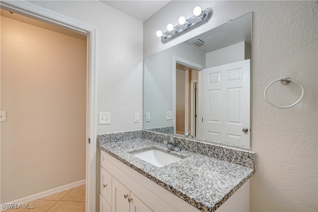 bathroom featuring tile patterned floors and vanity