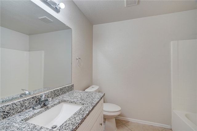 full bathroom featuring tile patterned floors, shower / tub combination, vanity, toilet, and a textured ceiling