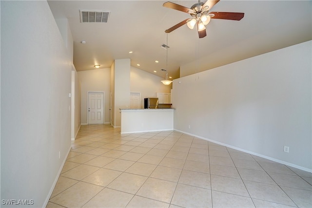 spare room featuring high vaulted ceiling, ceiling fan, and light tile patterned flooring