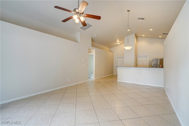 unfurnished living room featuring light tile patterned floors and high vaulted ceiling