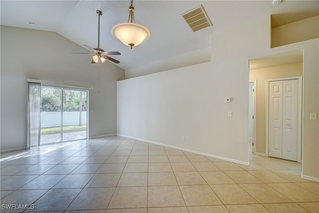 tiled empty room featuring high vaulted ceiling and ceiling fan