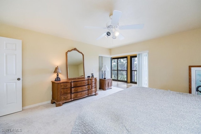 carpeted bedroom with access to exterior and ceiling fan