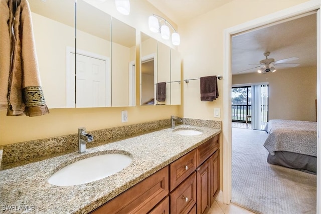 bathroom featuring tile patterned floors, ceiling fan, and vanity