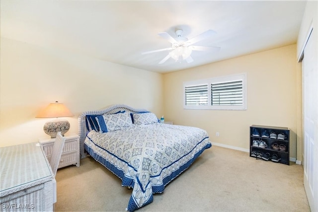 carpeted bedroom featuring ceiling fan