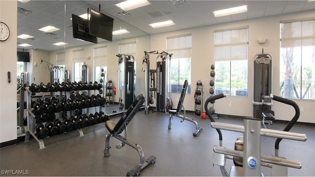 workout area featuring a paneled ceiling