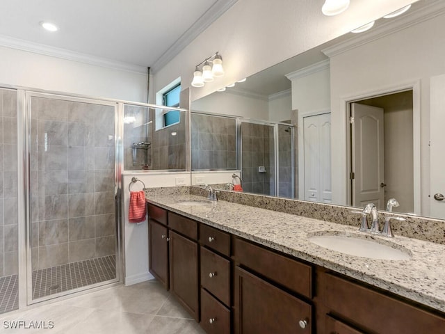 bathroom with vanity, an enclosed shower, ornamental molding, and tile patterned floors