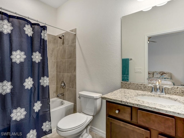 full bathroom with vanity, shower / tub combo, and toilet