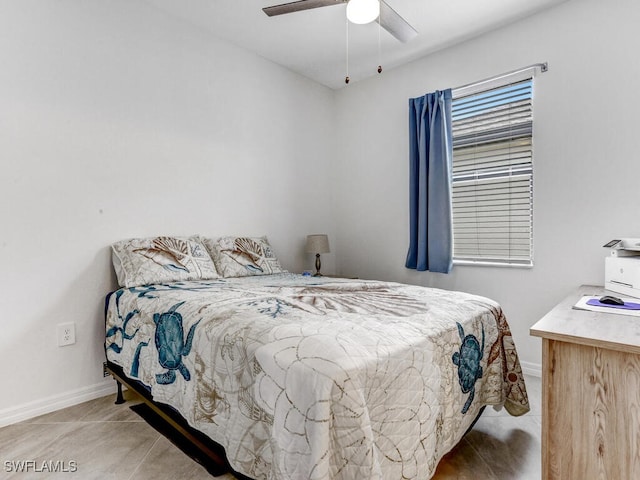 bedroom with ceiling fan and light tile patterned floors