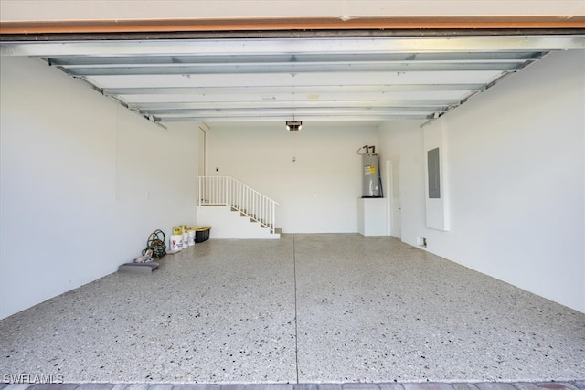 garage featuring water heater and electric panel