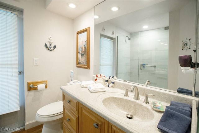 207 SE 20th Pl, Cape Coral, FL 33990 - bathroom featuring a shower with shower door, toilet, vanity, recessed lighting, and baseboards