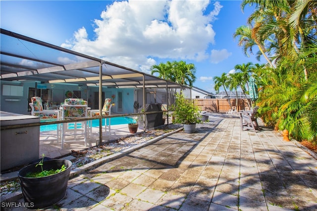 view of patio featuring a fenced in pool and a lanai