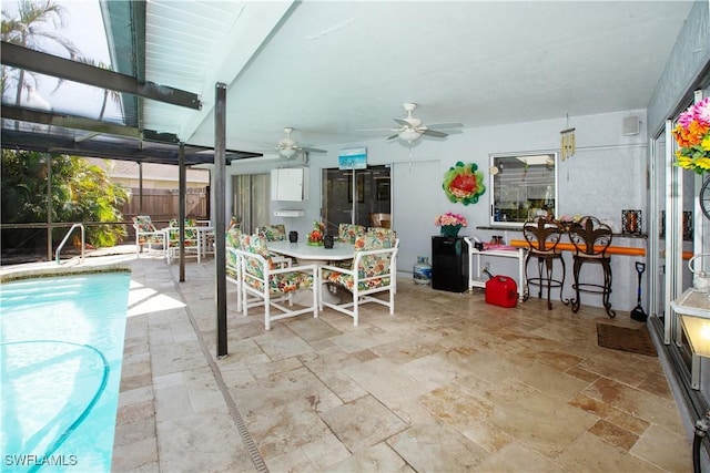 207 SE 20th Pl, Cape Coral, FL 33990 - view of patio featuring ceiling fan, outdoor dining area, an outdoor pool, a lanai, and fence