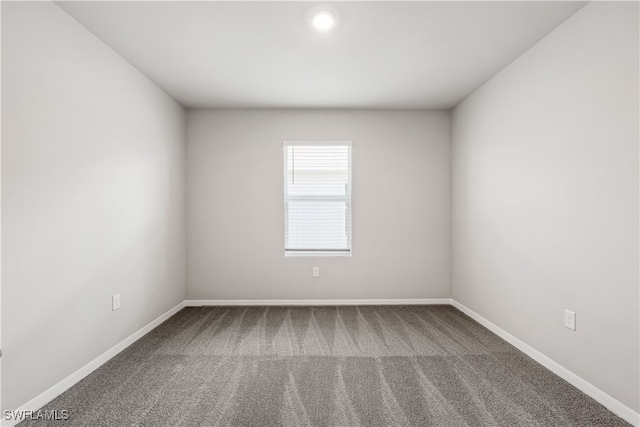 unfurnished room with carpet floors