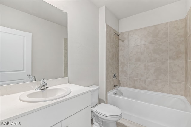 full bathroom with vanity, toilet, and tiled shower / bath combo