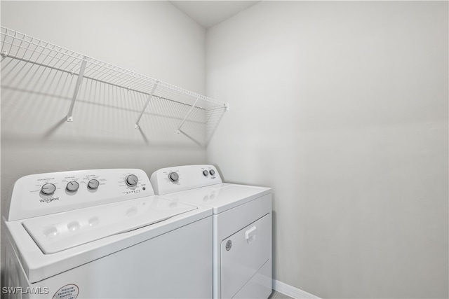 washroom with washer and dryer