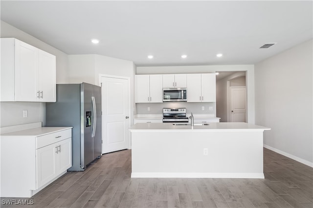 kitchen featuring a center island with sink, light wood-type flooring, white cabinetry, and stainless steel appliances