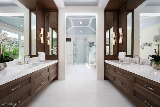 bathroom with vanity and a shower with shower door