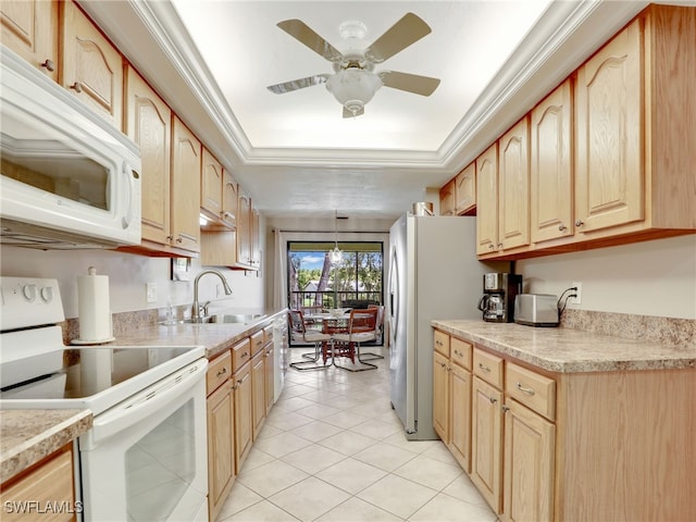 kitchen with light brown cabinets, light tile patterned floors, sink, decorative light fixtures, and white appliances