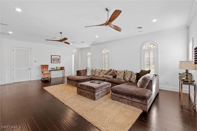 living area featuring visible vents, ceiling fan, ornamental molding, dark wood-style flooring, and recessed lighting