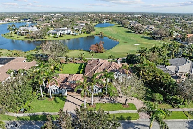 aerial view with view of golf course, a water view, and a residential view