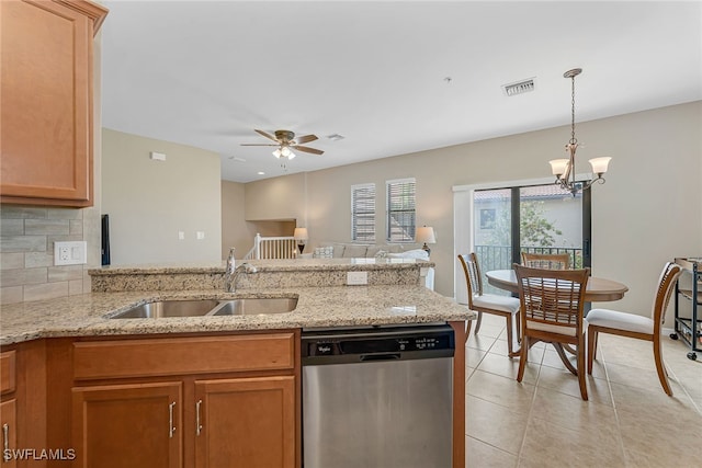 kitchen featuring tasteful backsplash, light tile patterned floors, dishwasher, ceiling fan with notable chandelier, and sink