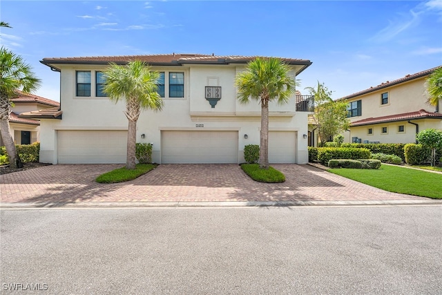 mediterranean / spanish-style home featuring a garage