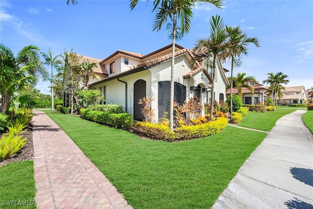 view of home's exterior with a lawn