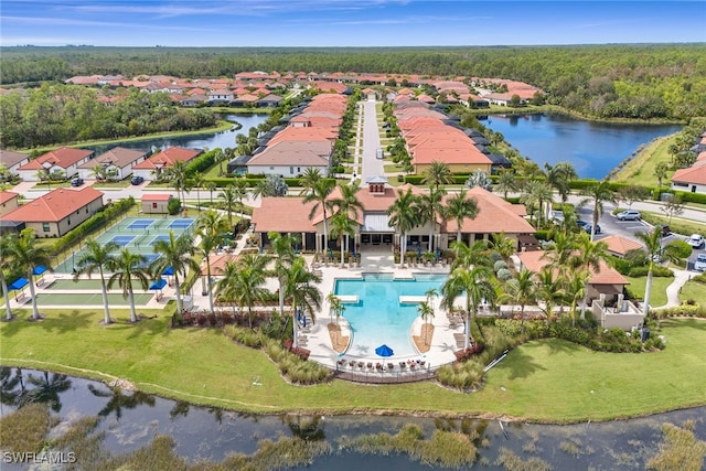 birds eye view of property with a water view