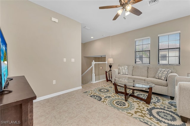 tiled living room featuring ceiling fan