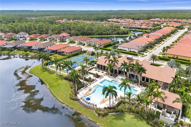 birds eye view of property with a water view