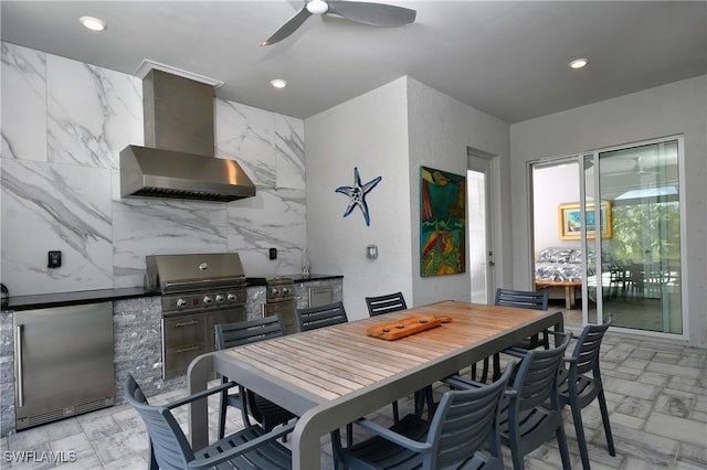 view of patio / terrace with grilling area, an outdoor kitchen, and ceiling fan