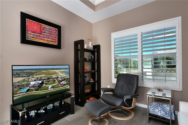 living area with hardwood / wood-style flooring