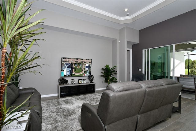 living room with light hardwood / wood-style flooring and ornamental molding