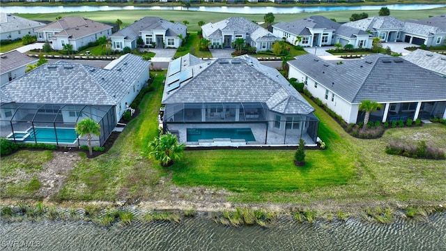 drone / aerial view with a water view