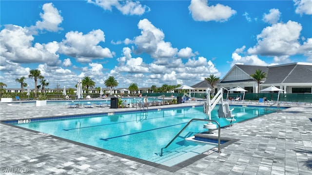 view of swimming pool featuring a patio area