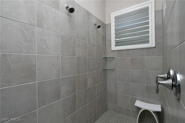 bathroom with tiled shower