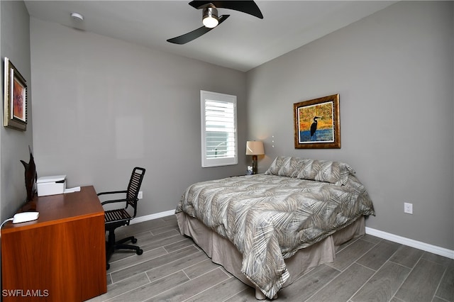 bedroom featuring hardwood / wood-style floors and ceiling fan