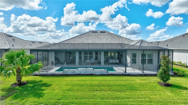 rear view of property with a lanai, a patio area, and a lawn