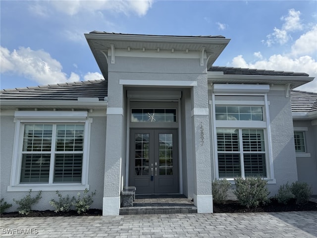 entrance to property featuring french doors