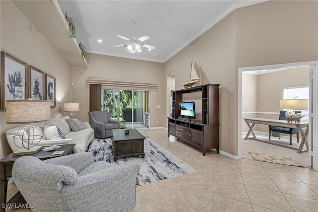 living room with crown molding, ceiling fan, a high ceiling, and light tile patterned floors