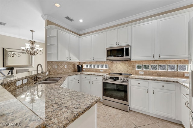 kitchen featuring appliances with stainless steel finishes, white cabinetry, and sink