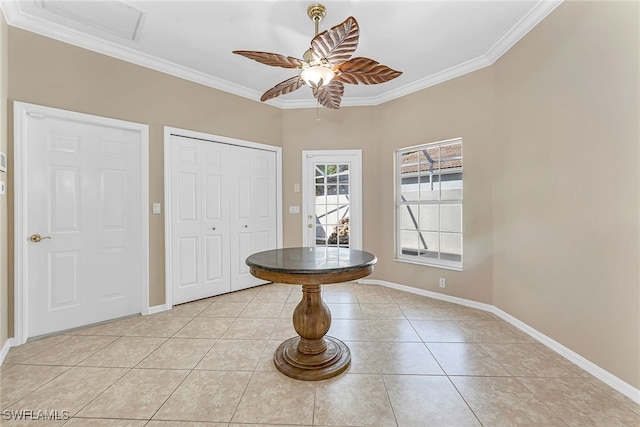 entryway featuring crown molding, light tile patterned flooring, and ceiling fan